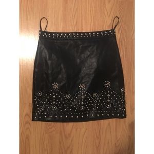 Faux leather mini skirt with studded detail